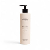A LA MAISON Body Crème Amber bottle front, signaling rich hydration for dry skin.