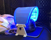 AAOCARE Hydraskincare PDT LED panel shows red, blue, and yellow lights for skin glow.