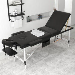 ABET massage table with height-adjustable legs for ergonomic comfort during treatments.
