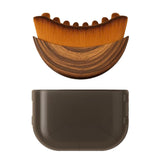 AEKI Lymphatic Contour Face Brush close-up reveals soft bristles for gentle facial massage.