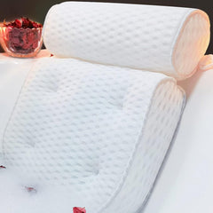 AEROiVi luxury bath pillow on tub edge offering plush neck support.