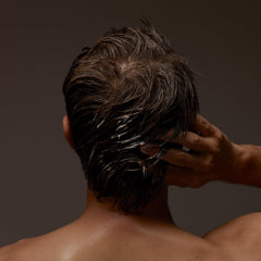 Aesop conditioner creaminess closeup emphasizes rich texture and hydration.