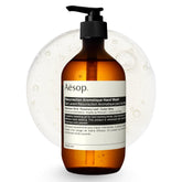 Aesop Resurrection hand wash bottle on sink for gentle cleansing and hydration.