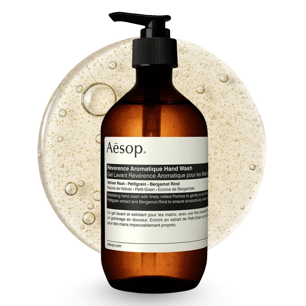 Aesop Reverence Exfoliating Hand Wash bottle on sink, offering a gentle daily exfoliation.