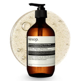 Aesop Reverence Exfoliating Hand Wash bottle on sink, offering a gentle daily exfoliation.