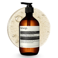 Aesop Reverence Exfoliating Hand Wash bottle on sink, offering a gentle daily exfoliation.