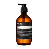 Aesop shampoo bottle with bergamot rind, showcasing cleansing action and citrus aroma.