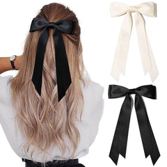 Aileam beige and black hair bows on a sturdy alligator clip for secure wear.