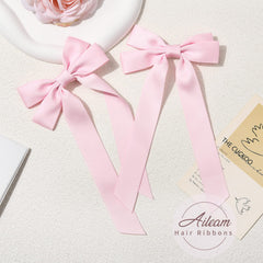 Aileam pink satin bow close-up highlighting soft texture for everyday wear.