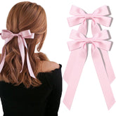 Aileam pink silky satin bow with an alligator clip for secure ponytails.