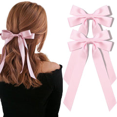 Aileam pink silky satin bow with an alligator clip for secure ponytails.