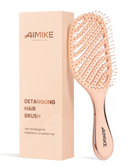 AIMIKE detangling brush with soft bristles gently glides through hair for smooth detangling.