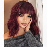 AISI HAIR curly bob wig with bangs in wine red for natural everyday style.