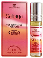 Al-Rehab Sabaya bottle on desk, alcohol-free unisex fragrance.