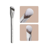 Albeaut Concealer Brush angled under-eye close-up for precise blending in delicate areas.