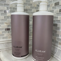 ALURAM Coconut Water Daily Shampoo pump highlighting detoxifying cleanse.
