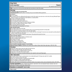 The Amazon Basic Care Minoxidil 5% Foam unscented formula label close-up on the can.