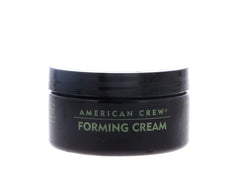 Hands applying American Crew Forming Cream for easy styling