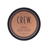 American Crew Pomada 85 g en botella, ideal para peinados con brillo intenso.