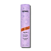 Amika Big Hit shampoo bottle close-up showing sleek packaging for volume.