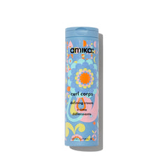 Amika Curl Corps Defining Cream bottle demonstrates smooth frizz control for defined curls.