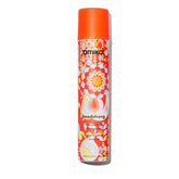 amika Headstrong hairspray bottle delivering fast, powerful hold with a flake-free finish.