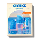 Amika hydro rush shampoo bottle visible, delivers lasting moisture and a gentle cleanse.