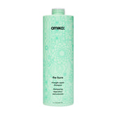 Amika The Kure Strength Repair Shampoo bottle close-up highlighting bond fortifying formula for stronger hair