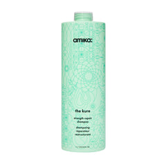 Amika The Kure Strength Repair Shampoo bottle close-up highlighting bond fortifying formula for stronger hair