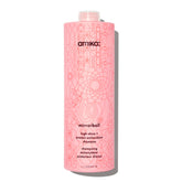 amika Mirrorball High Shine + Protect Shampoo bottle front boosts radiant shine