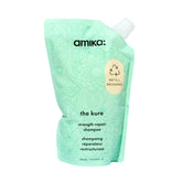 Amika The Kure Strength Repair Shampoo bottle close-up highlighting premium packaging and cleansing power