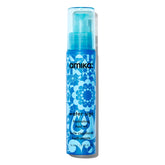 Amika Water Sign bottle pour shows precise dispensing for hydration.