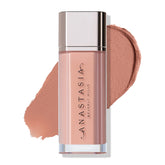 Anastasia Beverly Hills Lip Velvet Peachy Nude swatch showing true-matte color on lips