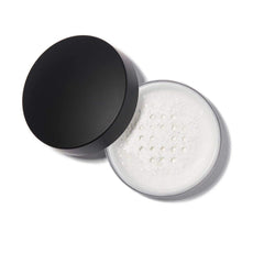 Anastasia Beverly Hills translucent powder puff applying for a mattifying, long-lasting finish.