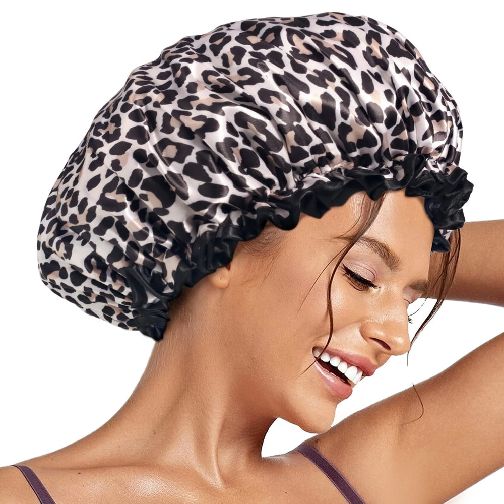 Aquior leopard shower cap on head keeps hair dry during shower
