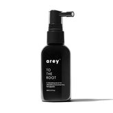 Arey To The Root serum bottle close-up for clean, vegan scalp care.