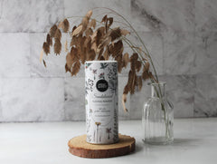 Herb & Root arrowroot dusting powder texture close-up for gentle, breathable use.