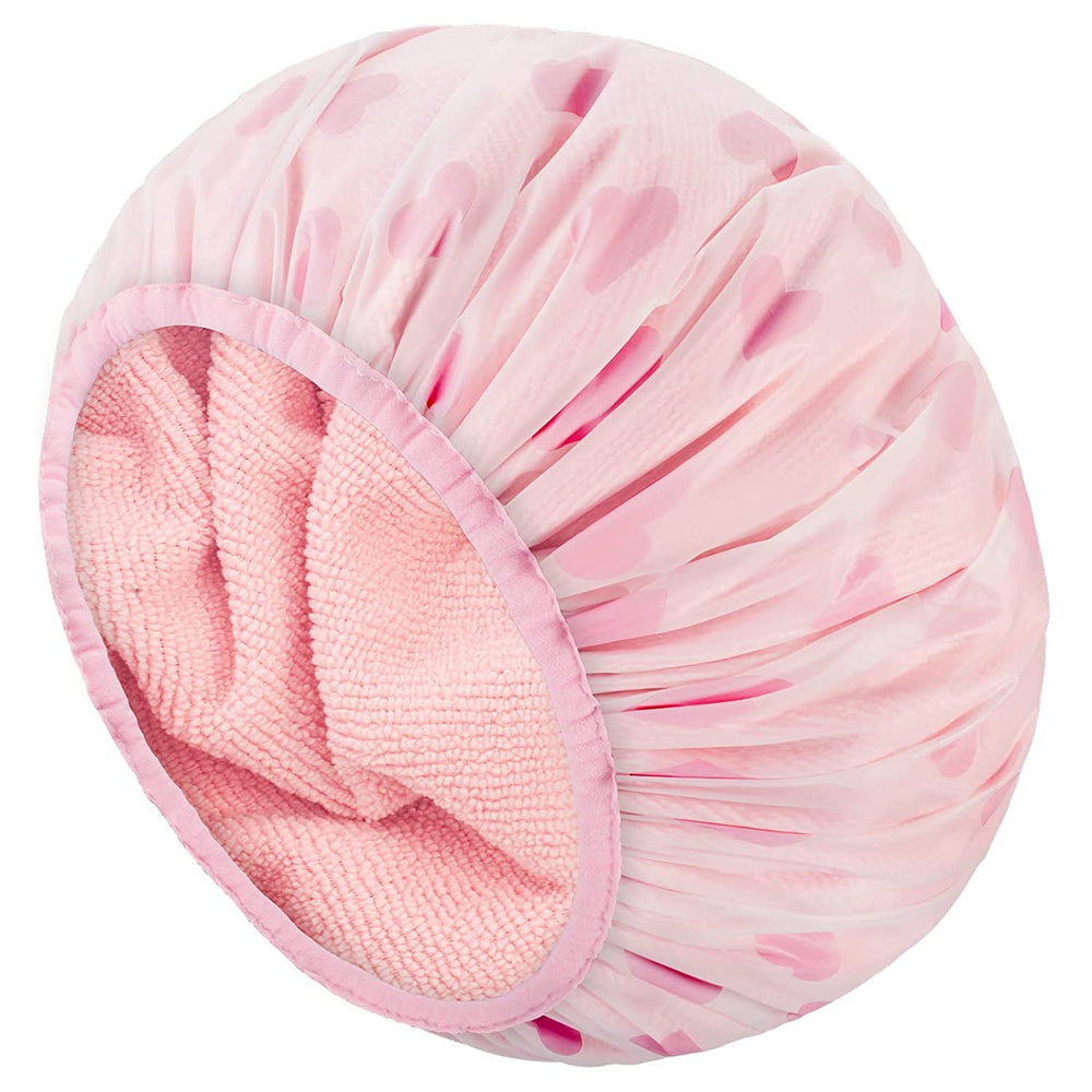 Auban Shower Cap with terry lining and pink exterior keeps hair dry and styled.