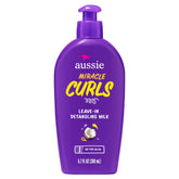 Aussie Miracle Curls detangling milk bottle eases knot-prone curls.
