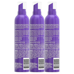 Hands applying Aussie Sprunch Mousse to damp curls for defined waves.