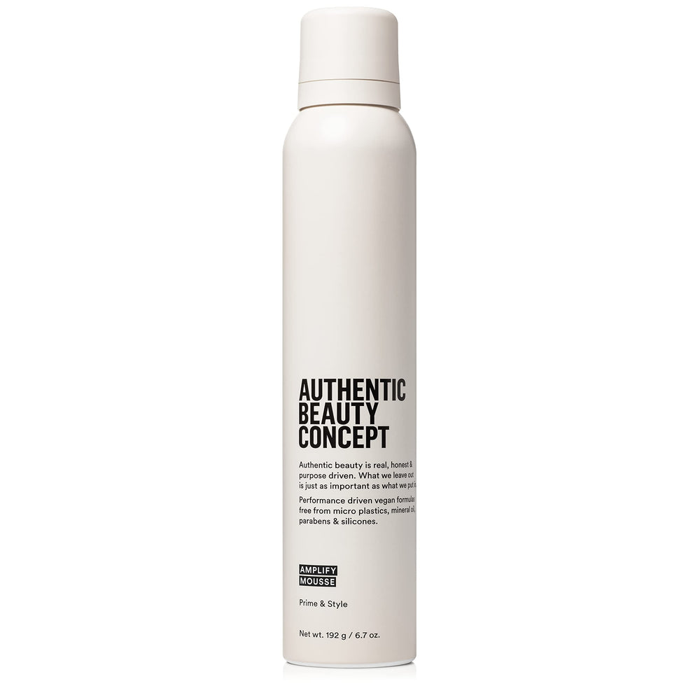 Authentic Beauty Concept Amplify Mousse bottle close-up showing lightweight volume.