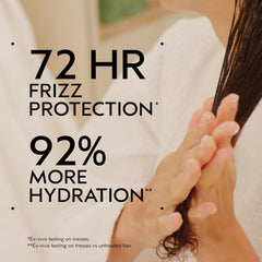 Aveda Be Curly Advanced Curl Enhancer cream swatch demonstrates definition and hydration.