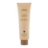 Aveda Blue Malva Color Conditioner bottle shows violet tint that neutralizes brassiness