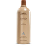 Aveda Blue Malva Shampoo bottle pour cools brassiness in gray and blonde hair.