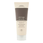 Aveda Damage Remedy bottle; promotes repair and strength for damaged hair.