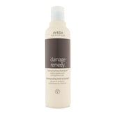 Aveda Damage Remedy shampoo bottle front shows repair and strengthening potential.