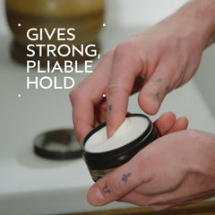 Aveda Men Pure-Formance Grooming Clay texture demonstration shows defined, pliable hold.