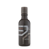 Aveda Men Pure-Formance Liquid Pomade bottle closeup for natural hold and shine