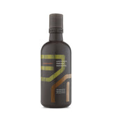 Aveda Men Pure-Formance Shampoo bottle refreshing the scalp and cleansing hair.