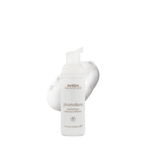 Phomollient de Aveda espuma ligera para volumen en cabello fino.